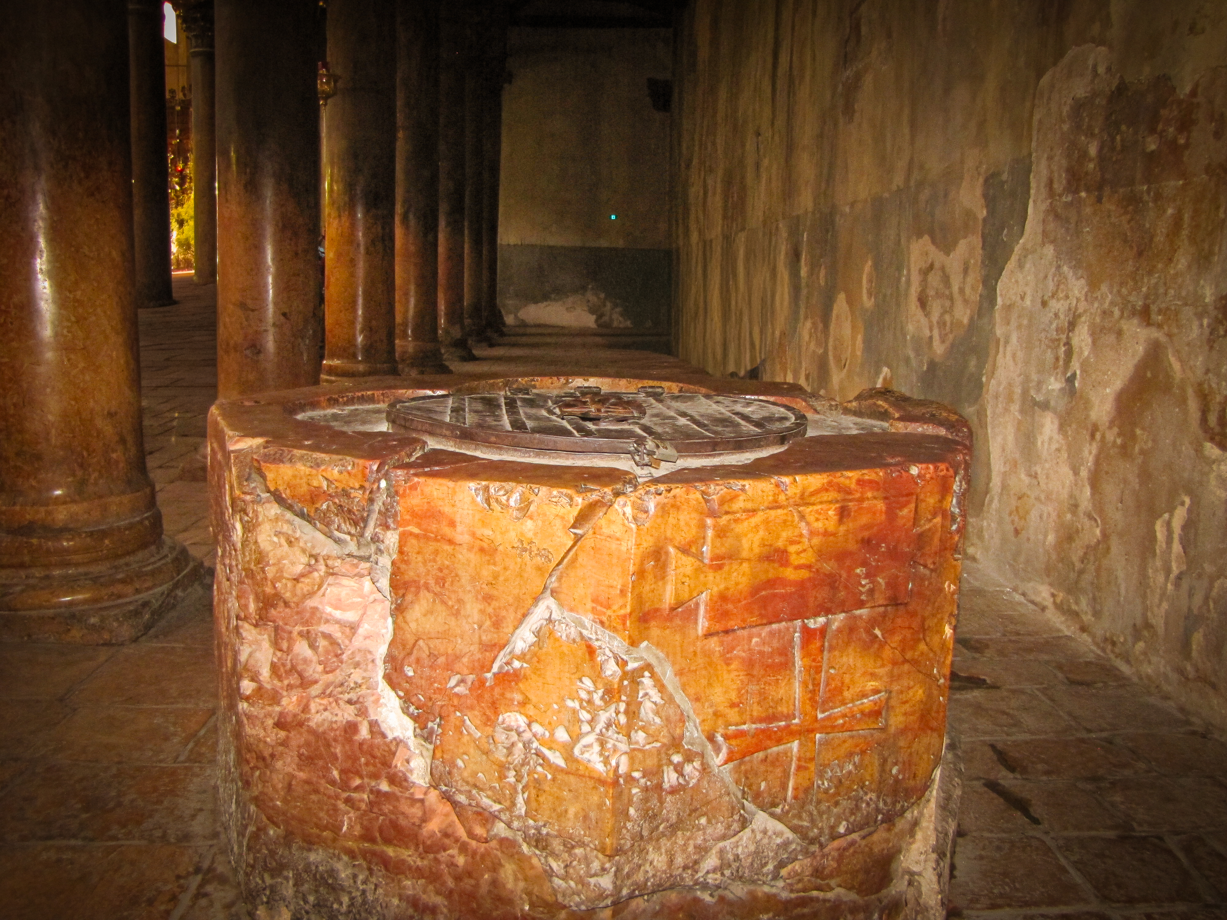 Baptismal Font of 540 AD with Marble Columns from 1169 AD in Bethlehem's Church of the Nativity 